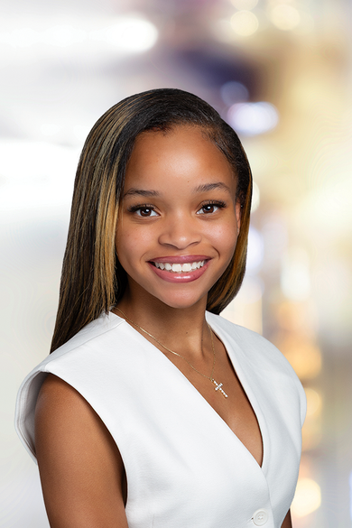 Portrait of Sydney Johnson, REALTOR® | NRLUX.